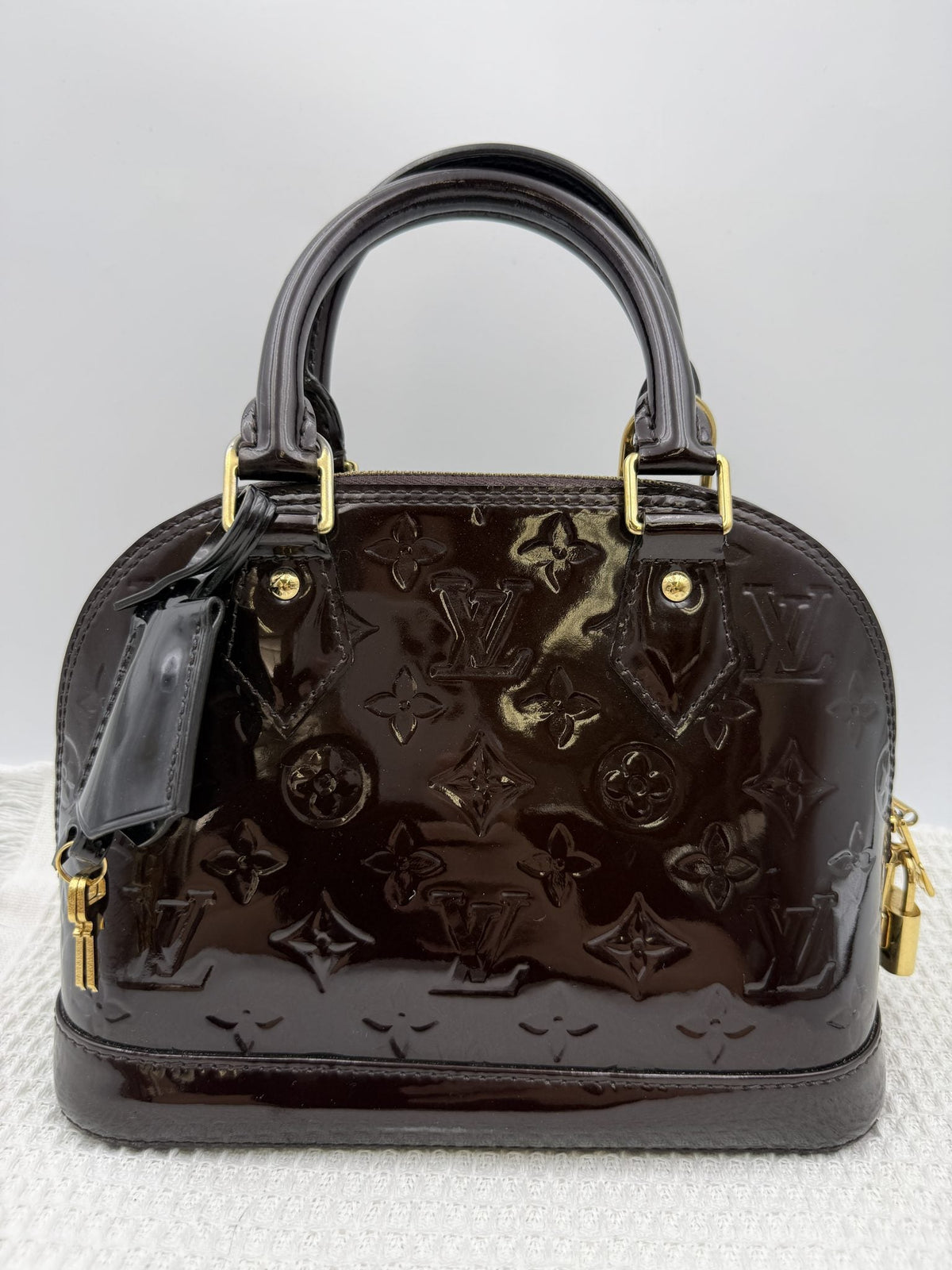 Louis Vuitton Alma BB - Amarante Monogram Vernis Leather front view