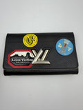 Louis Vuitton World Tour Twist Chain Wallet, Black and multicolor, stock 0256035 – front travel motifs