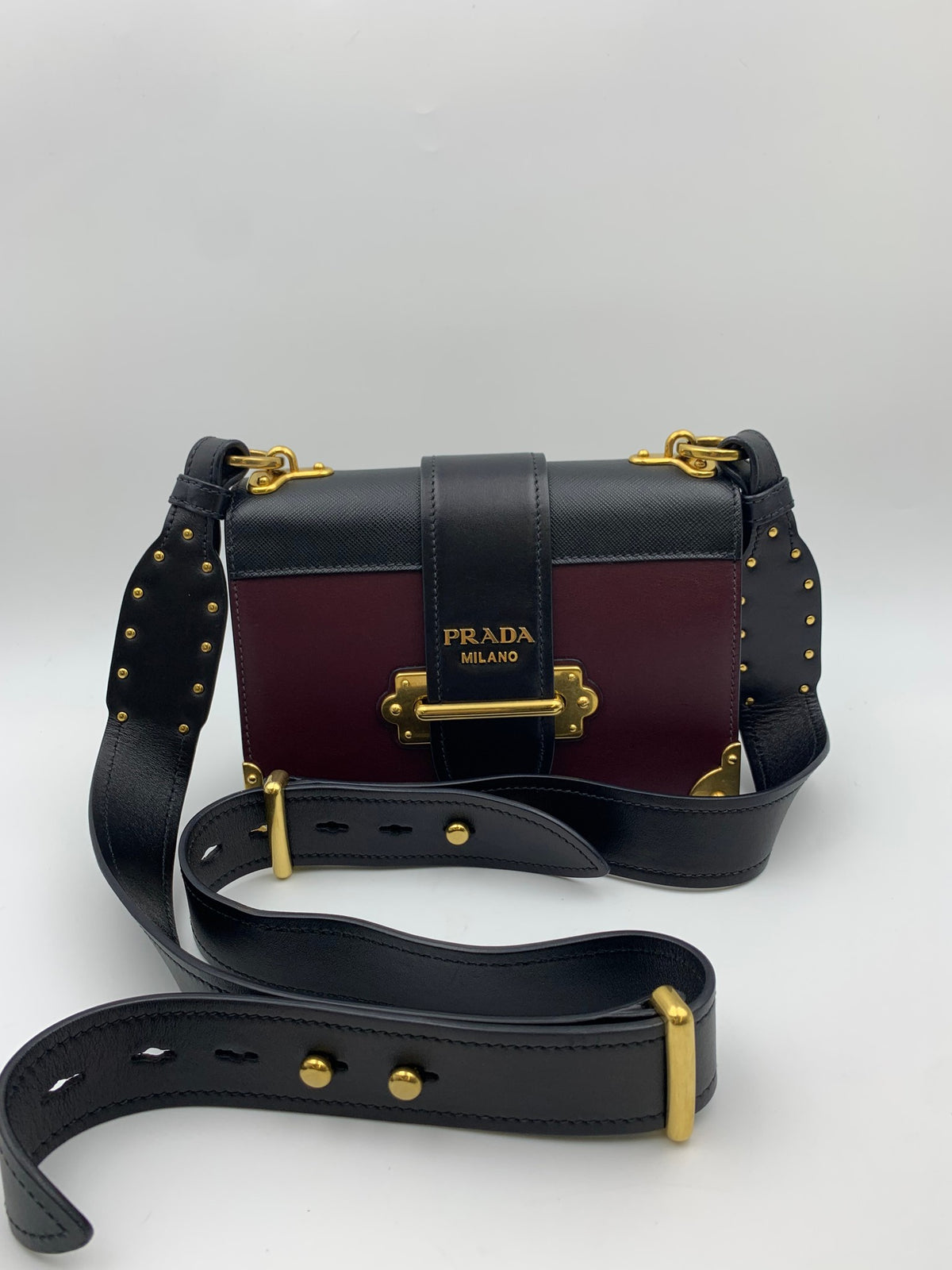 Prada Cahier Shoulder Bag, Burgundy and black, stock 0271024 – front and shoulder strap