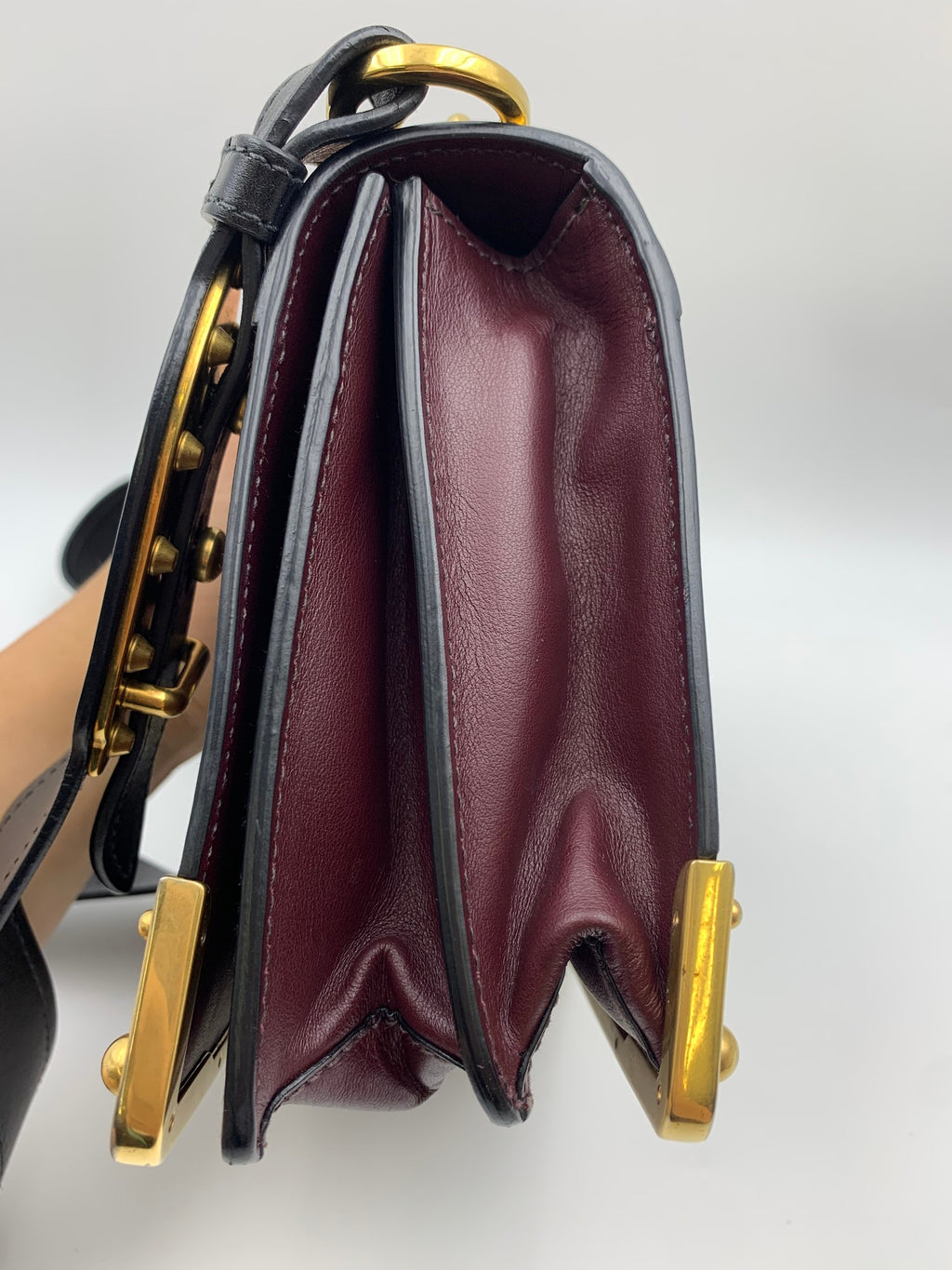 Prada Cahier Shoulder Bag, Burgundy and black, stock 0271024 – right side and strap attachment